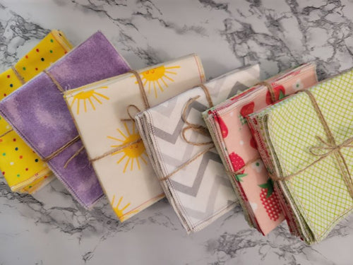 Six sets of six cotton flannel Unpaper towels wrapped with twine. Locally made in Wheaton, MD