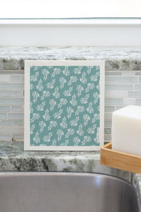 Image of single washcloud in Kleen Kelp pattern sitting on sink.