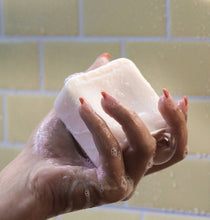 Load image into Gallery viewer, Photo from Dip showing a lathered shampoo bar in the shower.
