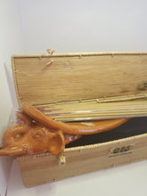 Load image into Gallery viewer, An orange, handmade, elephant shaped incense burner pokes out of a bamboo box. Some incense rest on top.  Handmade in Siam Reap, Cambodia.

